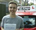 Matthew with Driving test pass certificate